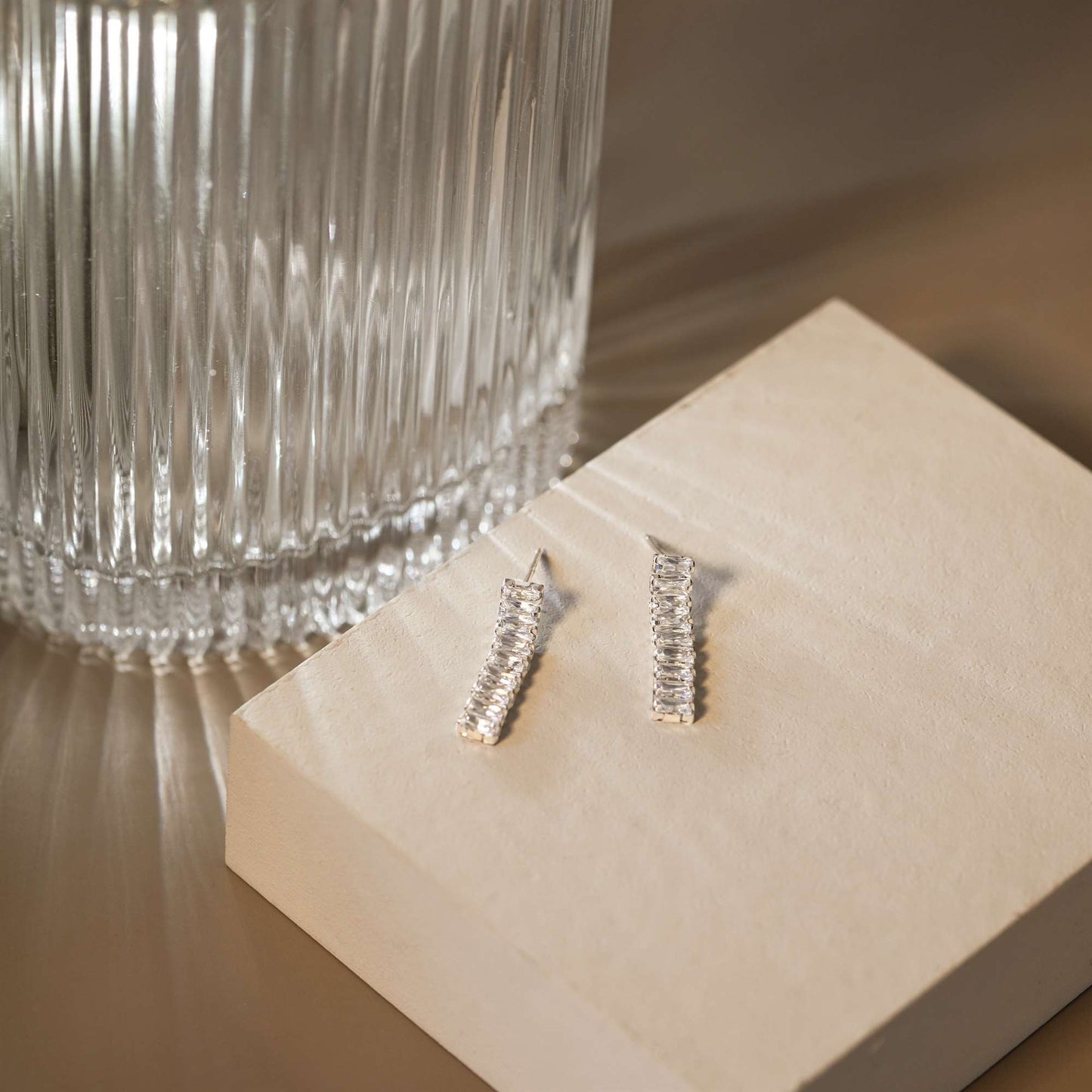 Statement dangling earrings with cubic zirconia baguettes