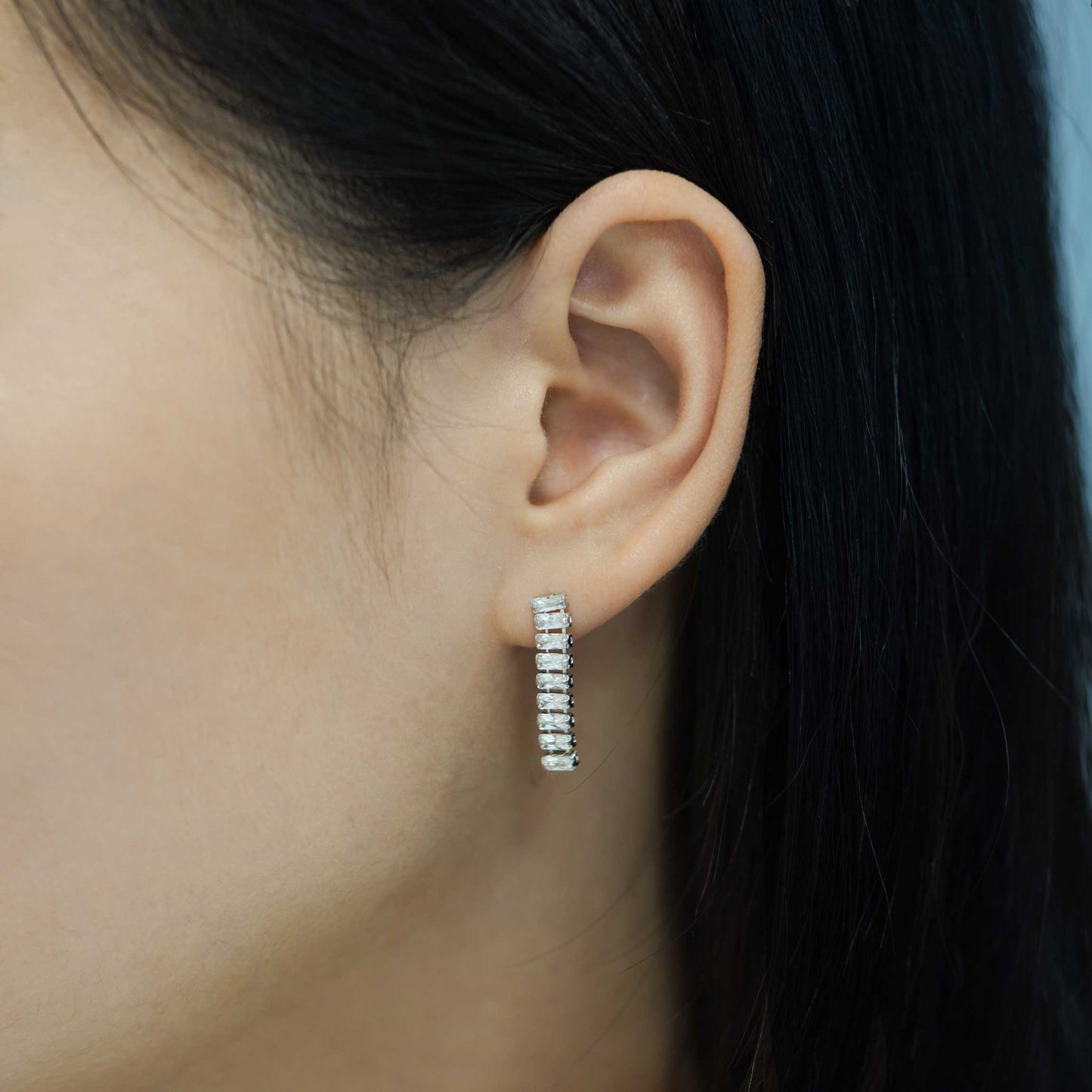 Statement dangling earrings with cubic zirconia baguettes