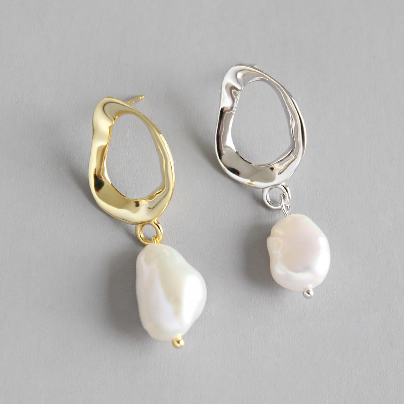 Irregular shaped earrings with cultivated baroque pearl