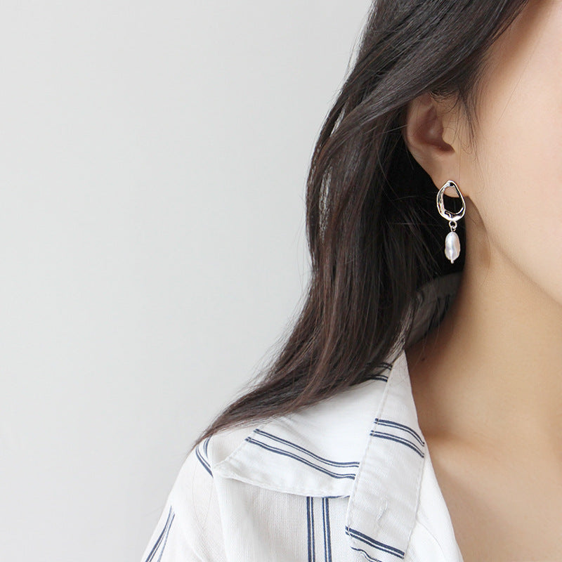 Irregular shaped earrings with cultivated baroque pearl