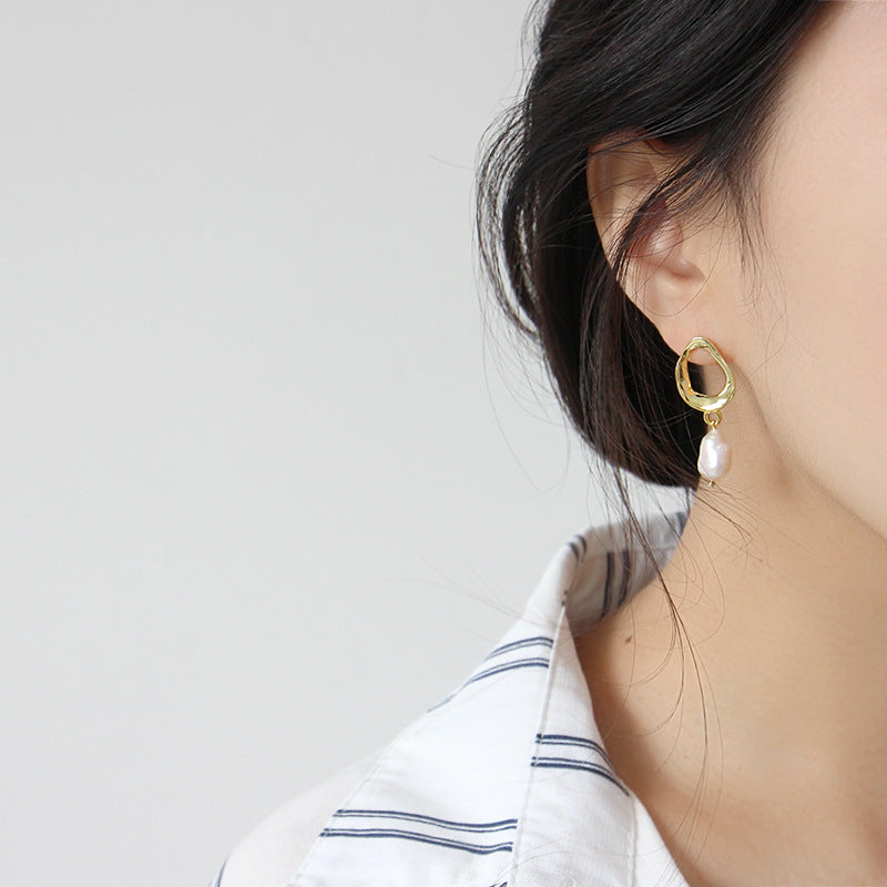Irregular shaped earrings with cultivated baroque pearl