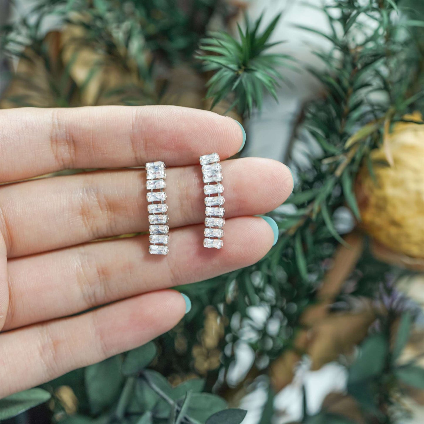 Statement dangling earrings with cubic zirconia baguettes
