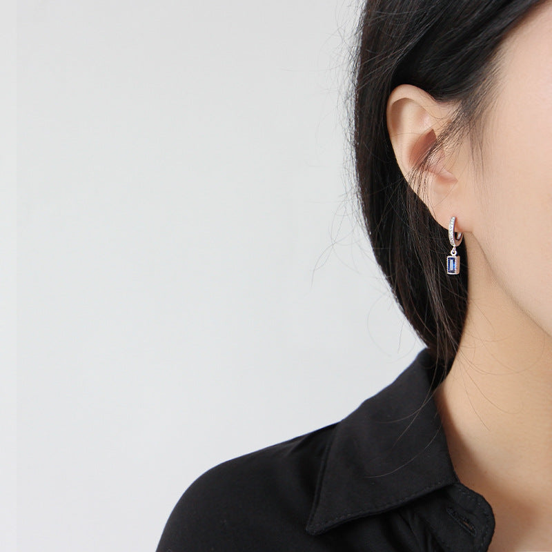 Earrings with dangling rectangular cubic zirconia