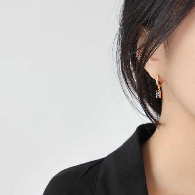 Earrings with dangling rectangular cubic zirconia
