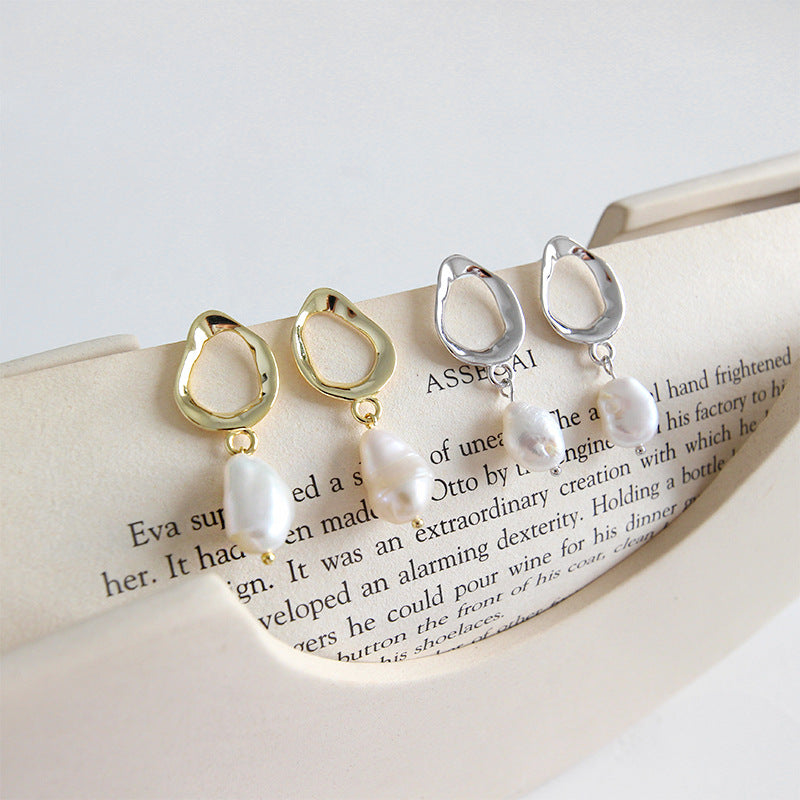 Irregular shaped earrings with cultivated baroque pearl