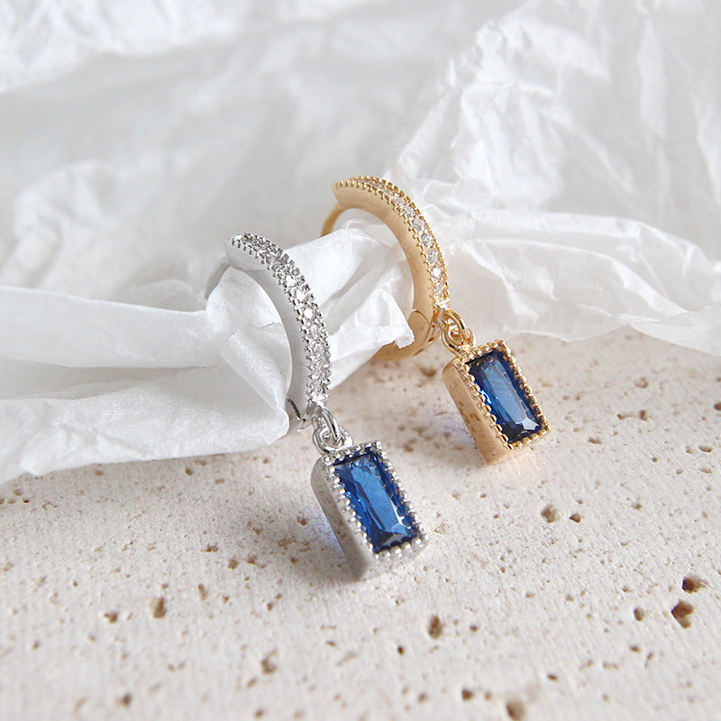 Earrings with dangling rectangular cubic zirconia